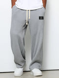 Men's Waffle-Textured Drawstring Trousers with Side Pockets and Wide Legs for Casual Wear